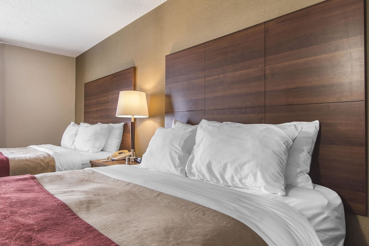 premium bedding, pillow-top beds, desk, laptop workspace