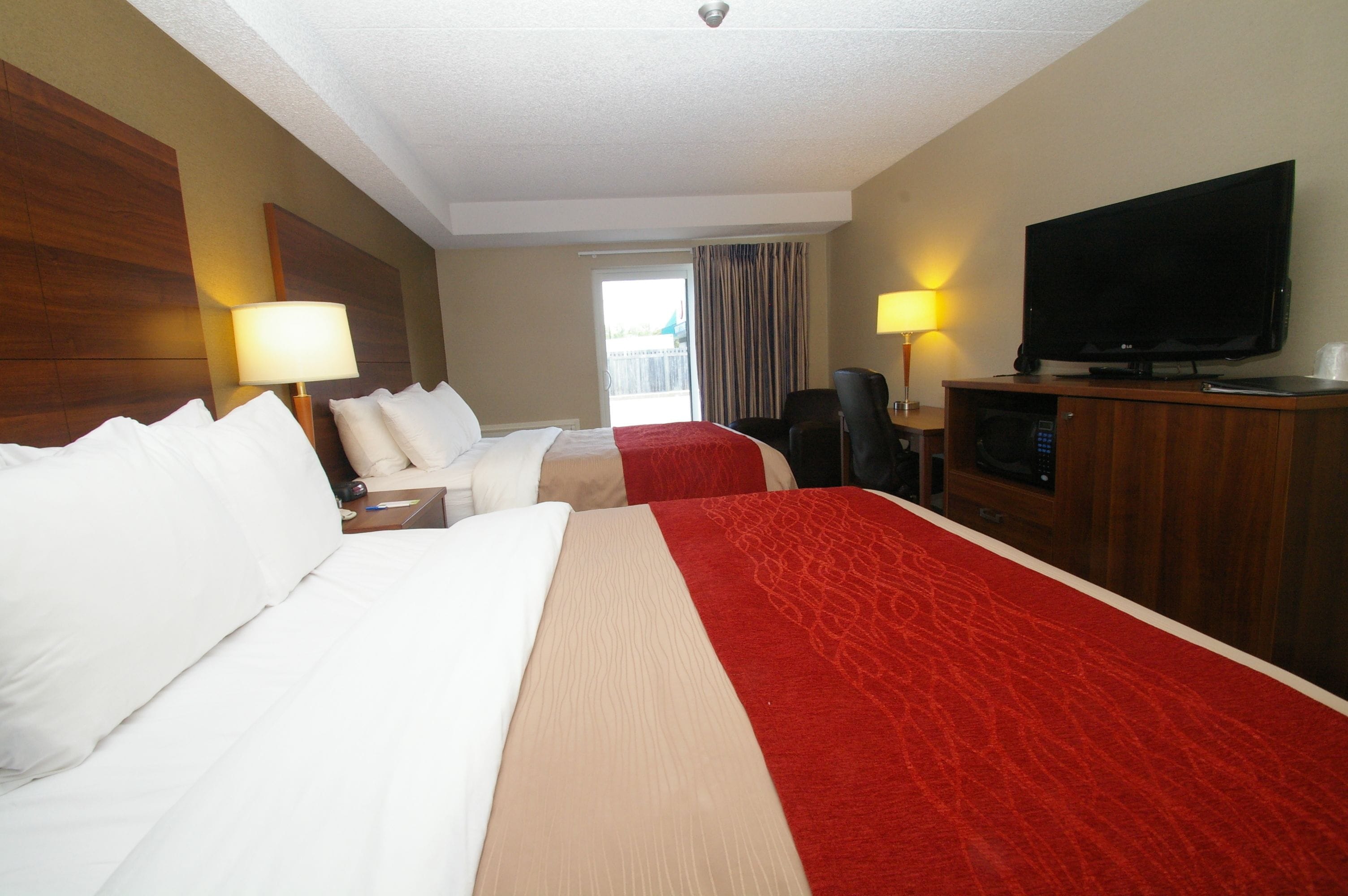 premium bedding, pillow-top beds, desk, laptop workspace