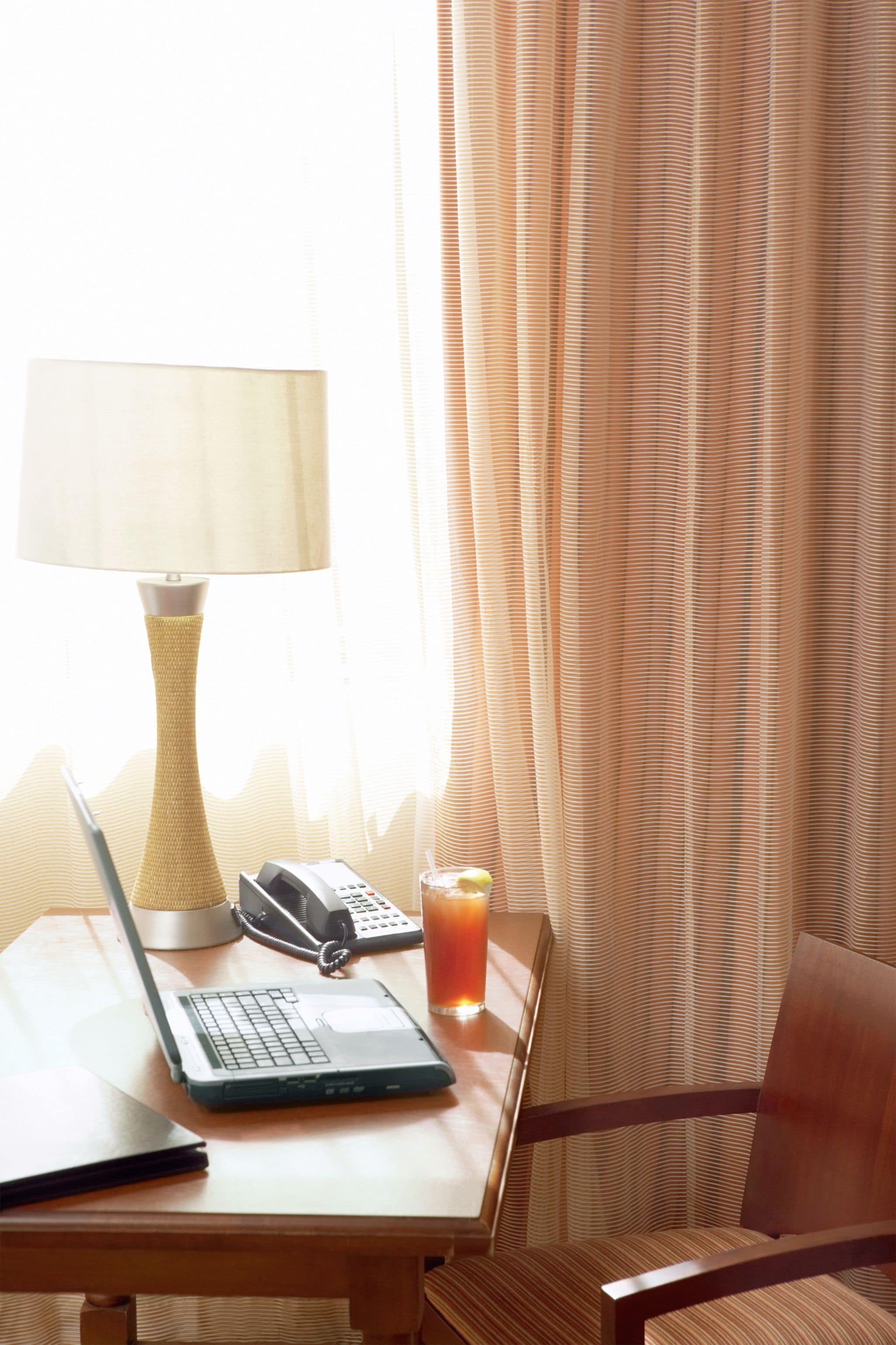 Premium bedding, desk, laptop workspace, soundproofing