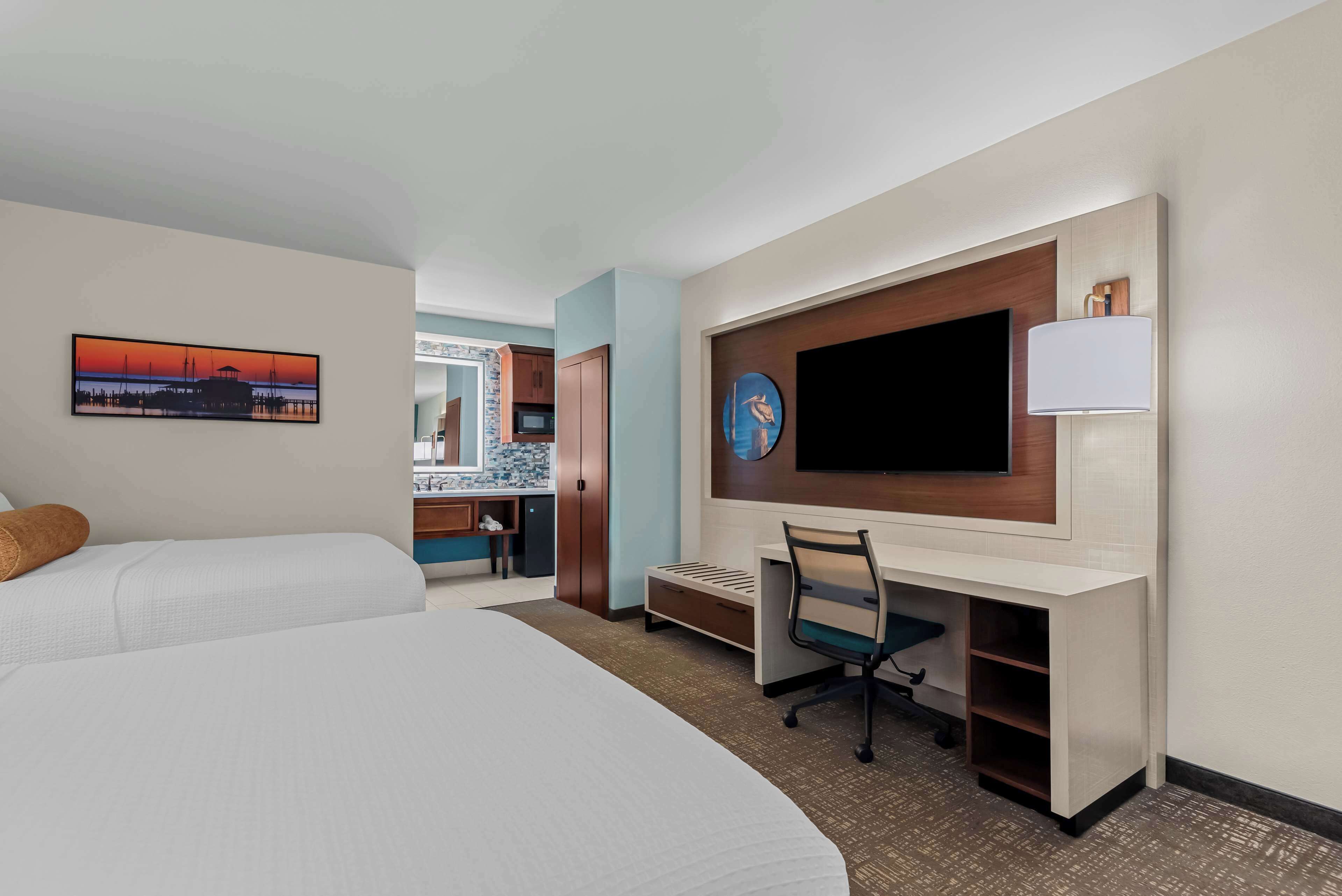 suite, 2 queen beds, non smoking, refrigerator & microwave (larger room) | pillow-top beds, individually furnished, desk, blackout curtains