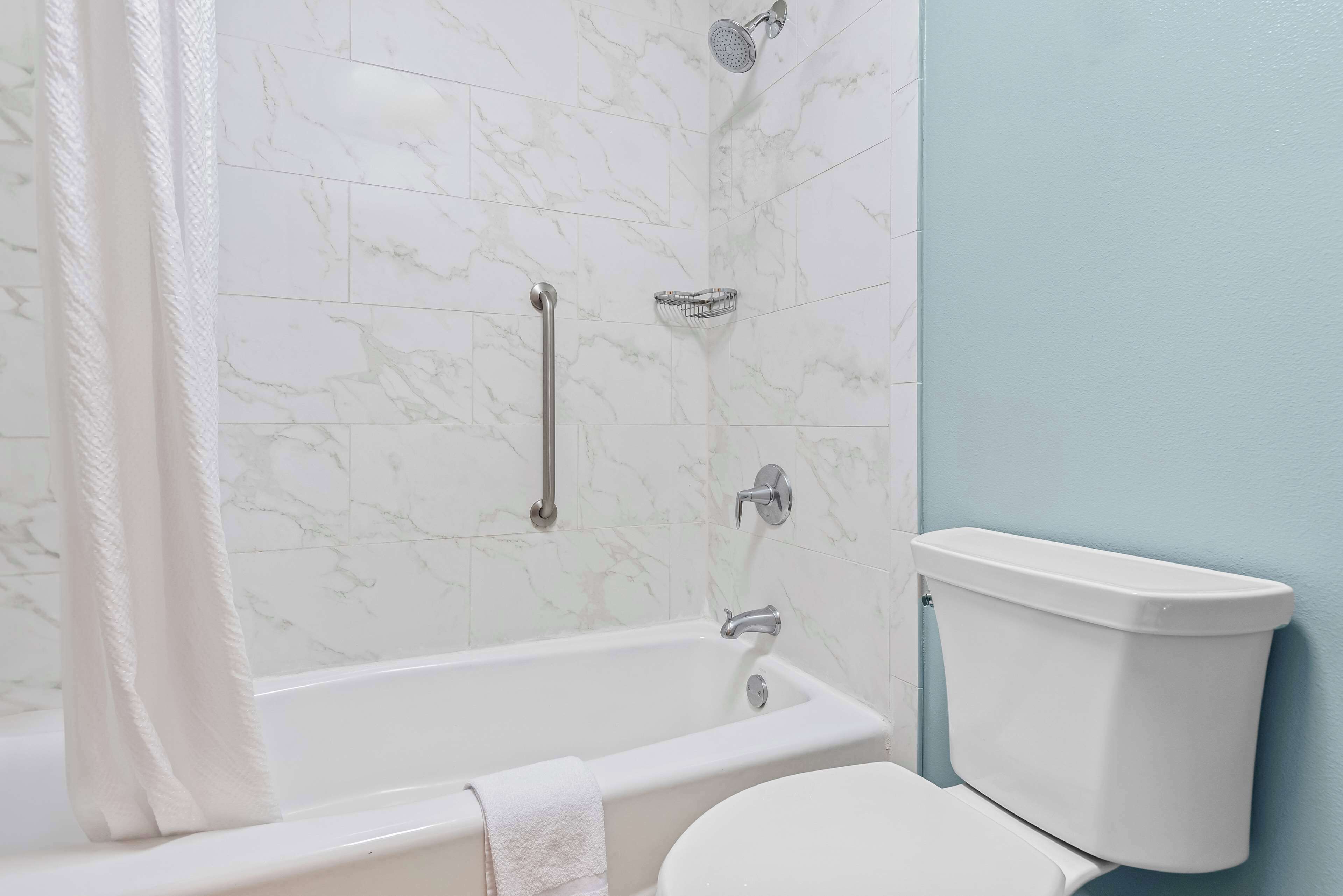 rainfall showerhead, eco-friendly toiletries, hair dryer, towels