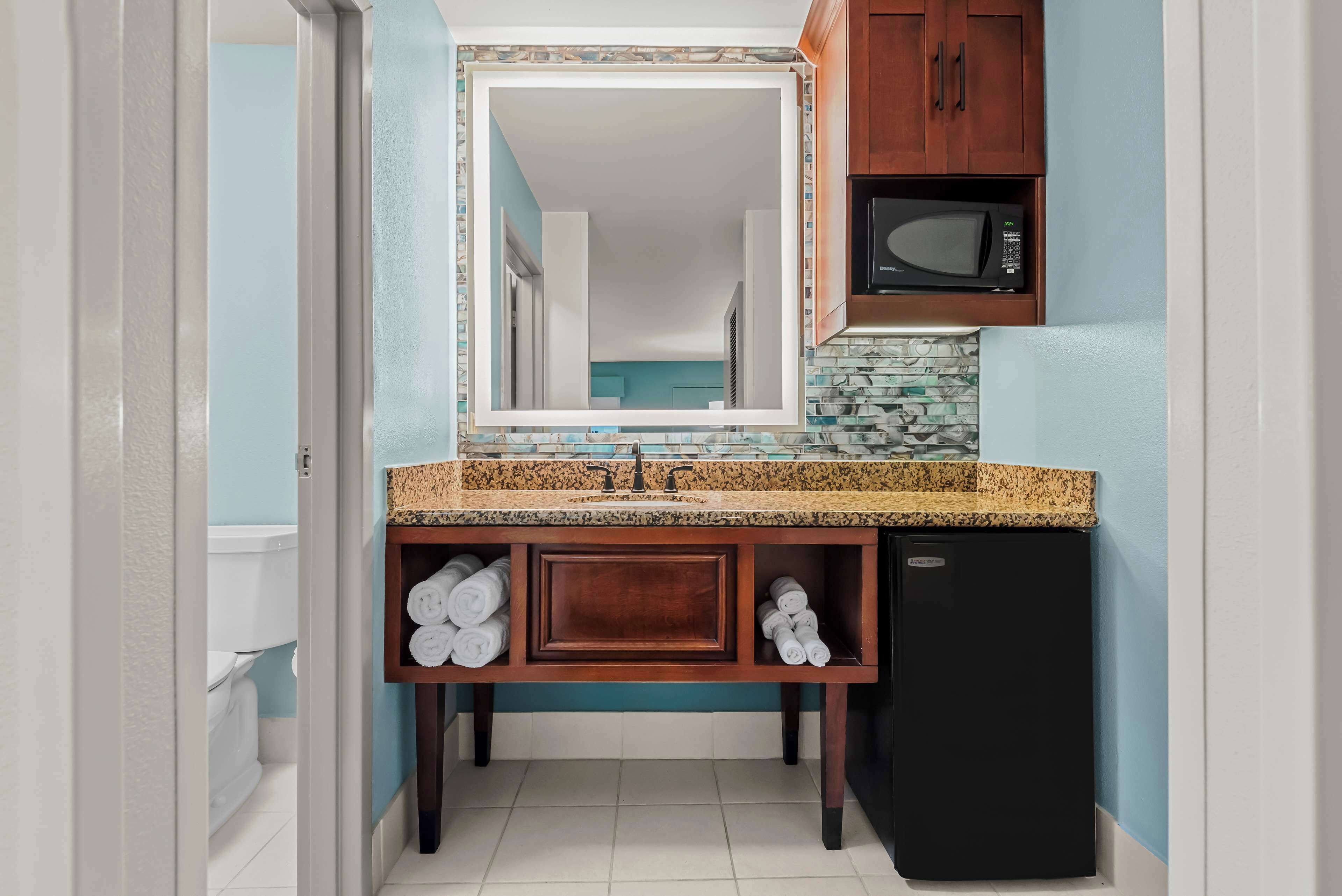 rainfall showerhead, eco-friendly toiletries, hair dryer, towels