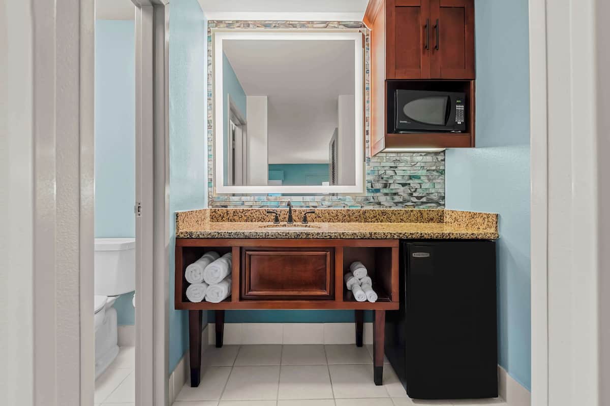 rainfall showerhead, eco-friendly toiletries, hair dryer, towels