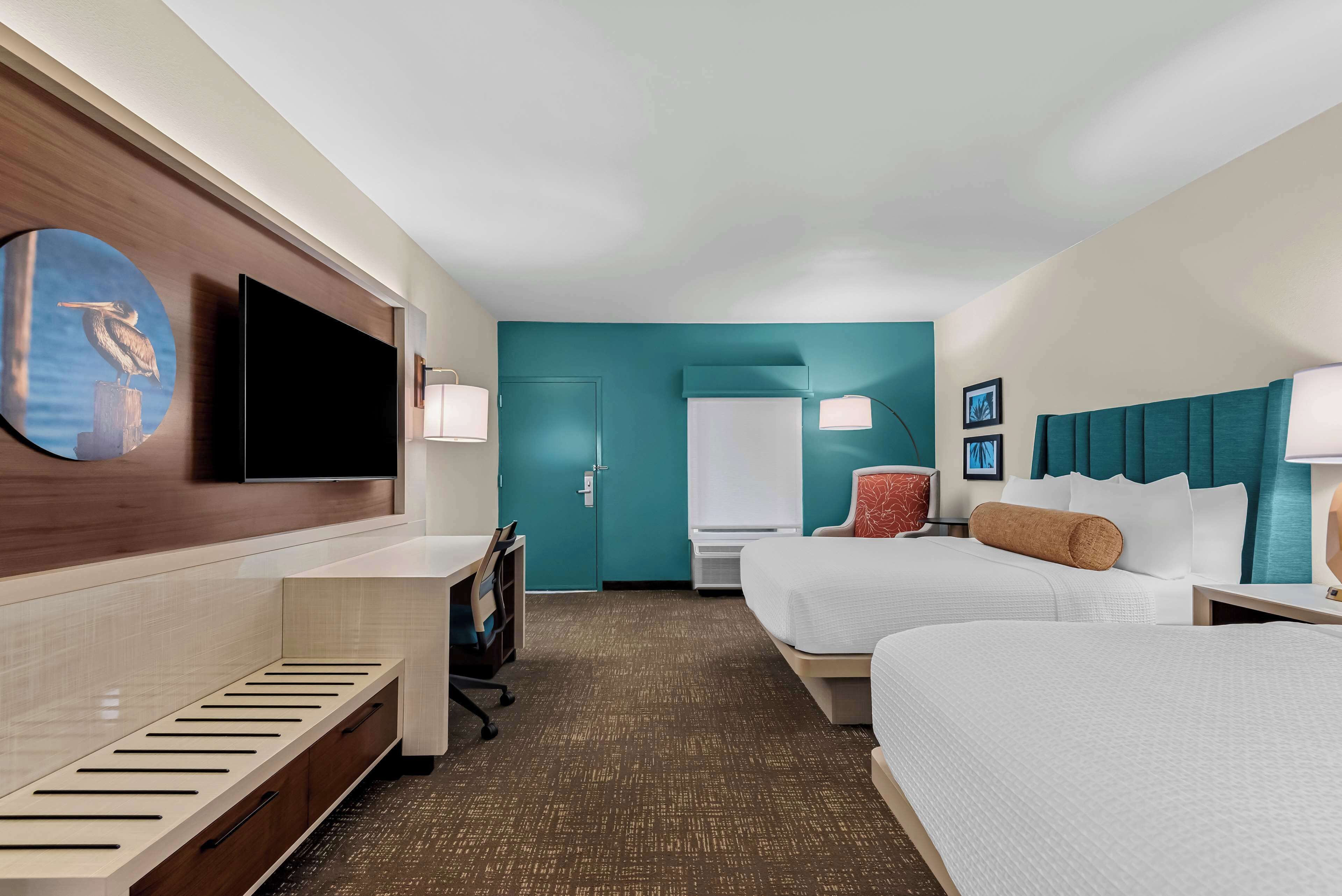 suite, 2 queen beds, non smoking, refrigerator & microwave (larger room) | pillow-top beds, individually furnished, desk, blackout curtains