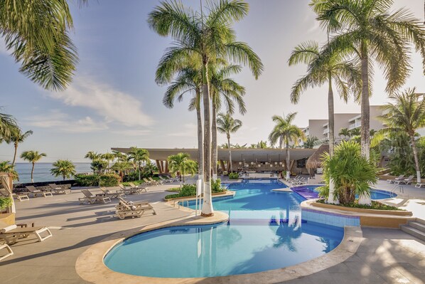 2 outdoor pools, open 8:00 AM to 8:00 PM, free cabanas, pool umbrellas