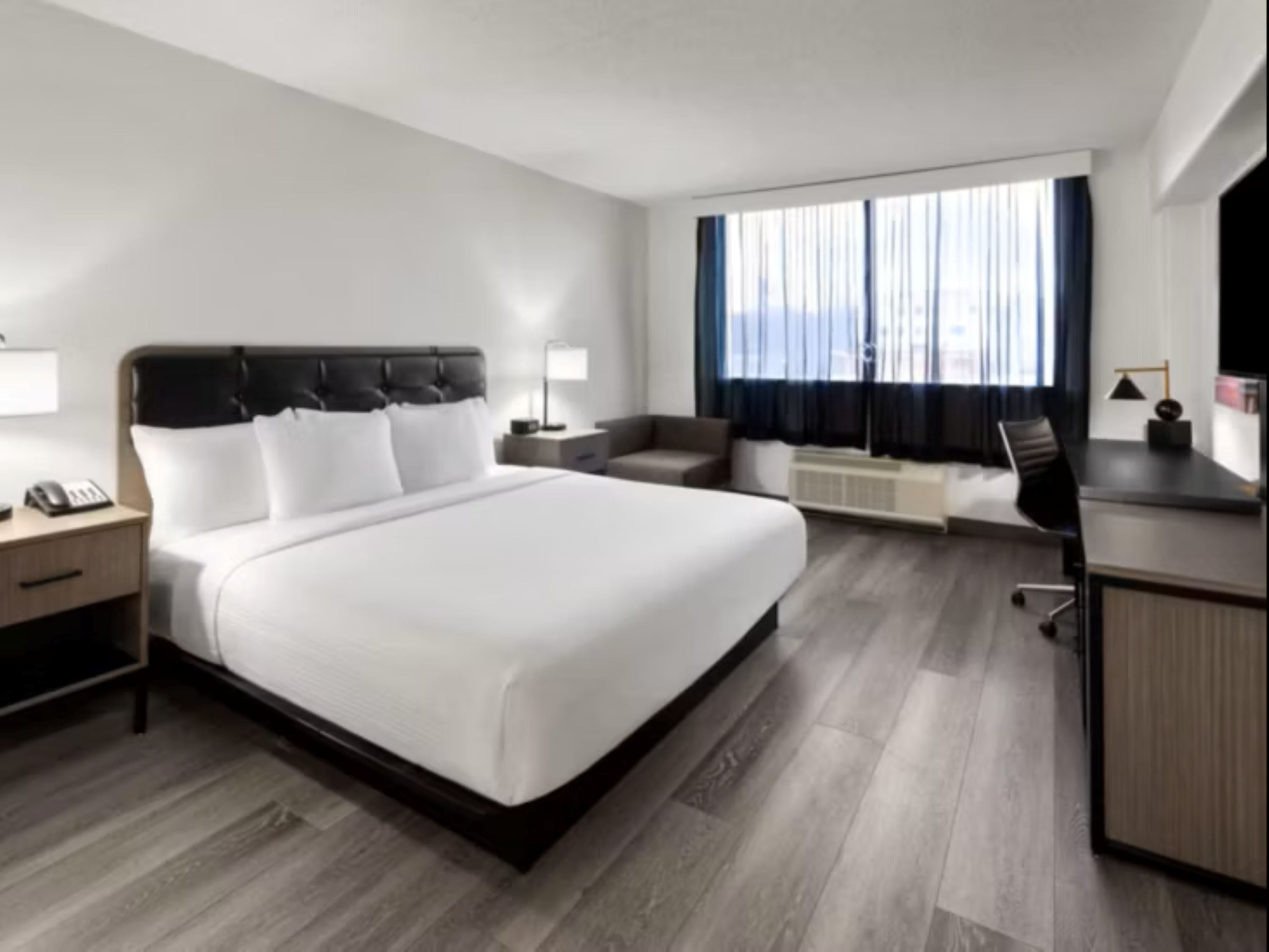 Desk, laptop workspace, iron/ironing board, free cribs/infant beds