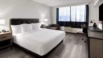 Desk, laptop workspace, iron/ironing board, free cribs/infant beds