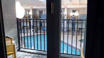 Room, 2 Queen Beds, Pool View | Hypo-allergenic bedding, in-room safe, desk, blackout drapes