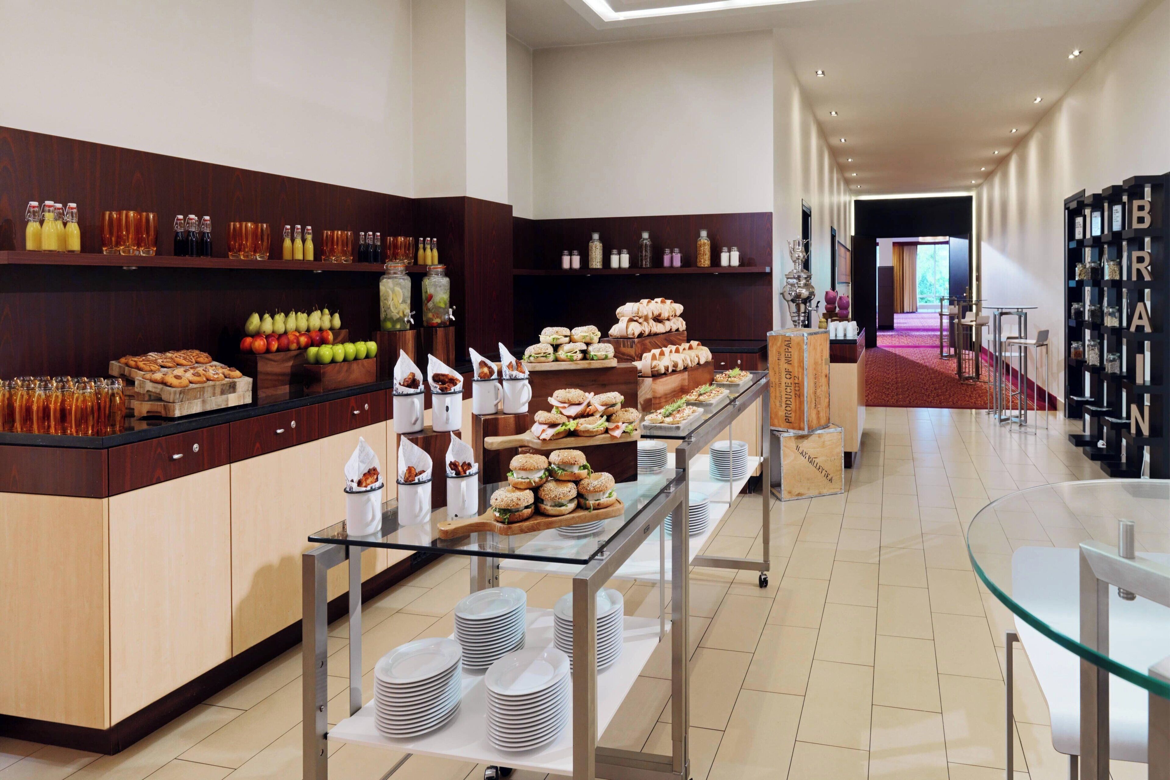 A buffet area with various food items and beverages.