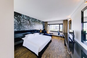 Premium bedding, down comforters, pillowtop beds, minibar