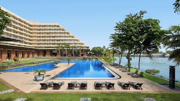 Outdoor pool, open 6:00 AM to 9:00 PM, pool umbrellas, pool loungers