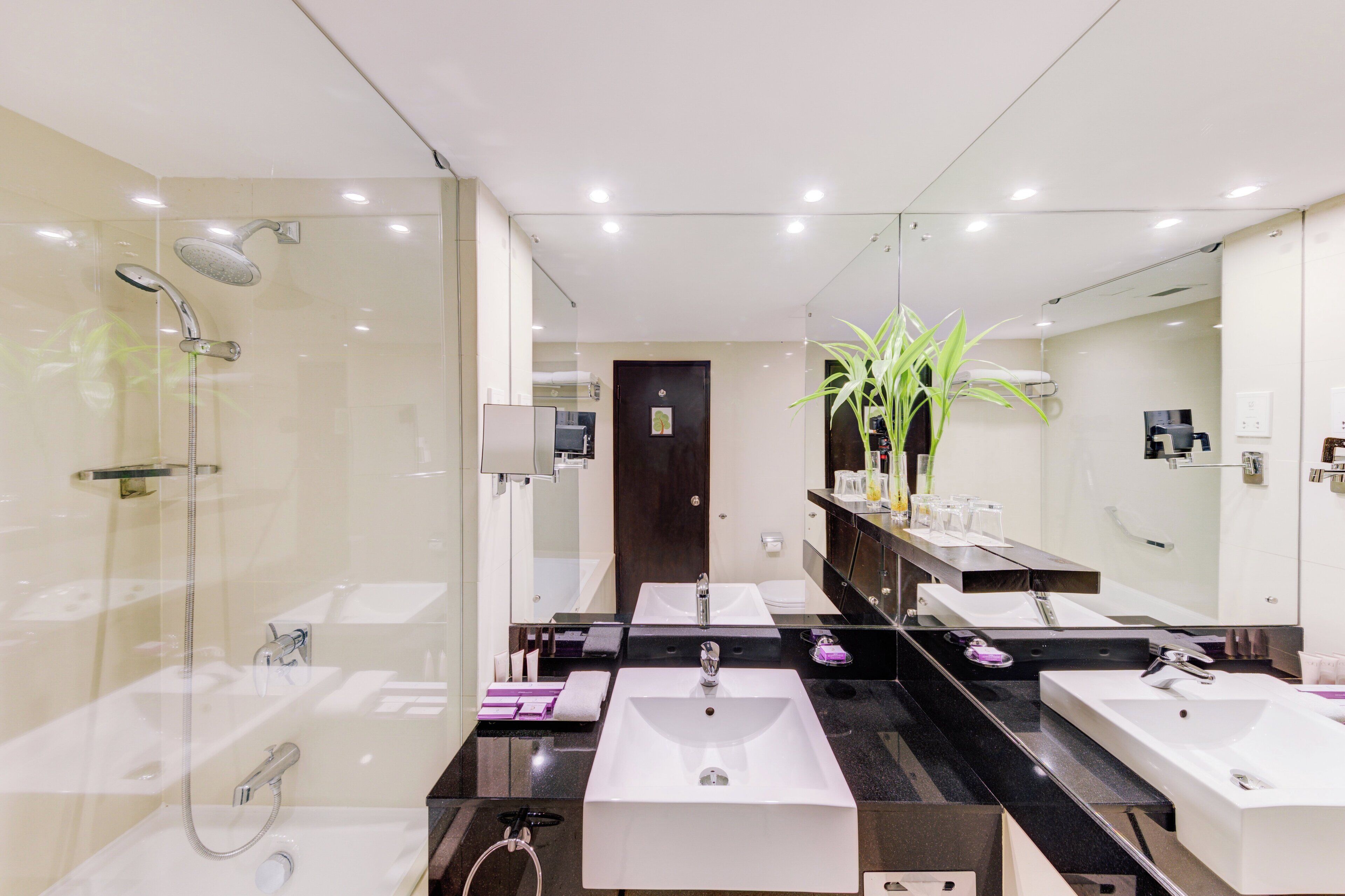 combined shower/bathtub, rainfall showerhead, eco-friendly toiletries