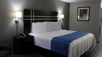 Desk, laptop workspace, blackout curtains, iron/ironing board