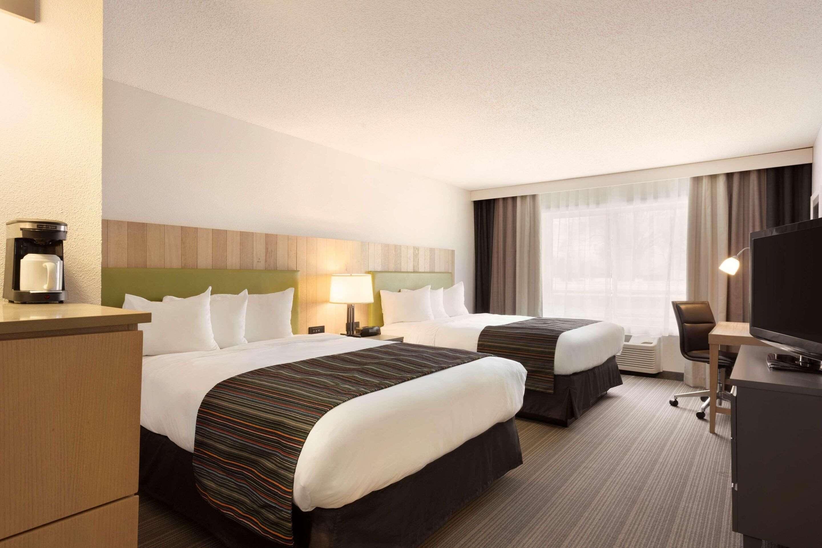 Premium bedding, pillowtop beds, desk, blackout drapes