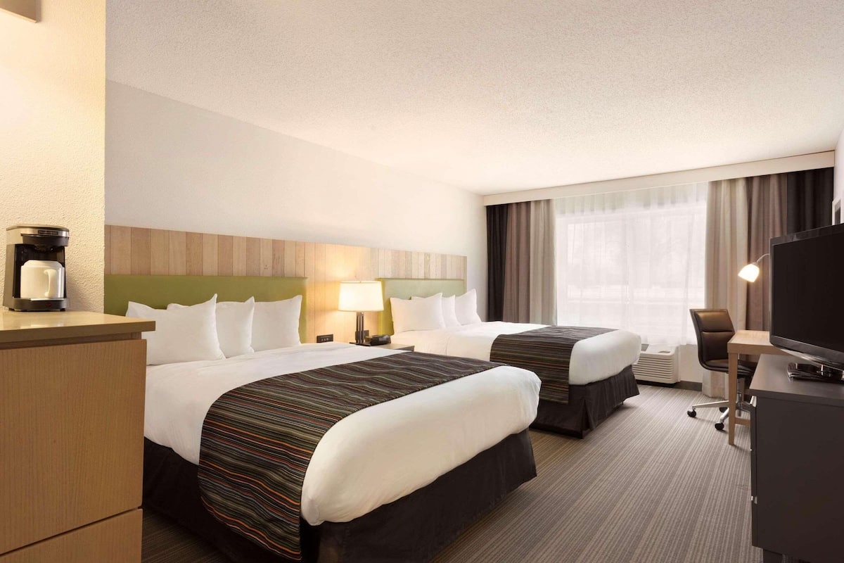 Premium bedding, pillowtop beds, desk, blackout drapes