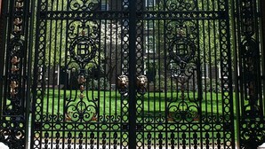 A black wrought iron gate with intricate designs and a crest emblem. - Providence Marriott Downtown (Providence)
