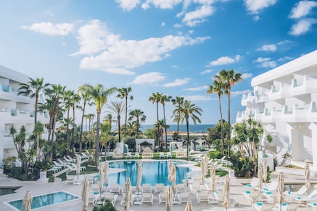 Outdoor pool, pool umbrellas, sun loungers. Iberostar Selection Marbella Coral Beach