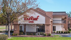 A building with a sign reading 'Red Roof Inn' and a fire lane marking. - Red Roof Inn Texarkana (Texarkana)