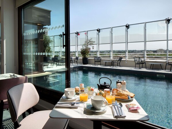 Rooftop bar, pool views, open daily