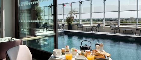 Rooftop bar, pool views, open daily