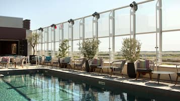 Indoor pool, seasonal outdoor pool, open 10 AM to 8 PM, pool loungers
