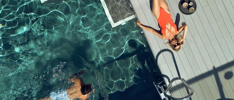 Indoor pool, seasonal outdoor pool, open 10 AM to 8 PM, pool loungers