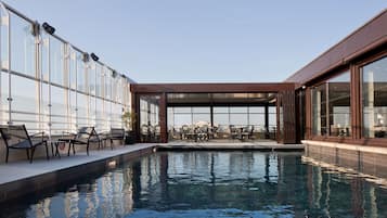 Indoor pool, seasonal outdoor pool, open 10 AM to 8 PM, pool loungers