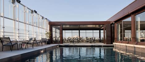 Indoor pool, seasonal outdoor pool, open 10 AM to 8 PM, pool loungers