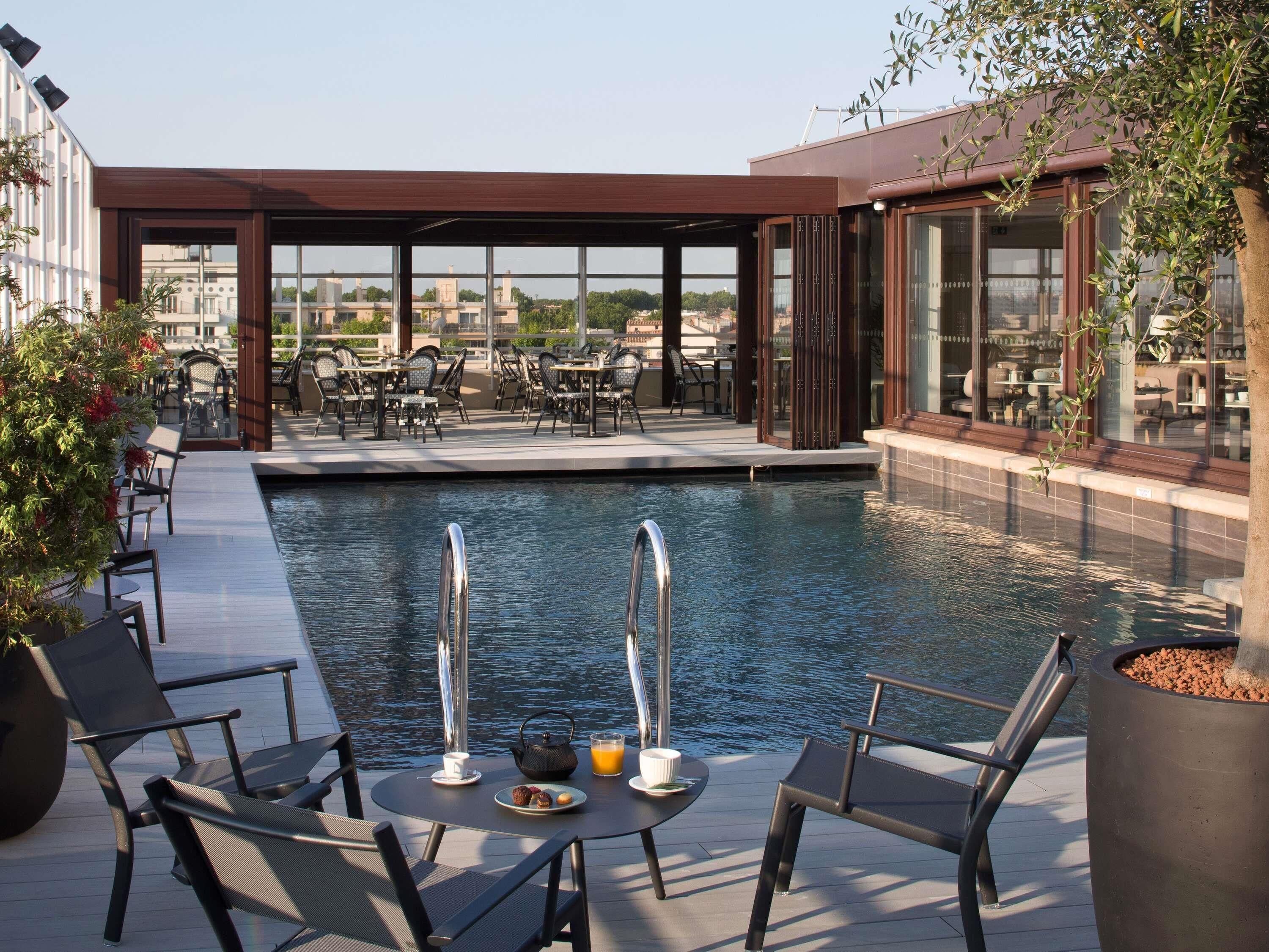 rooftop bar, pool views, open daily