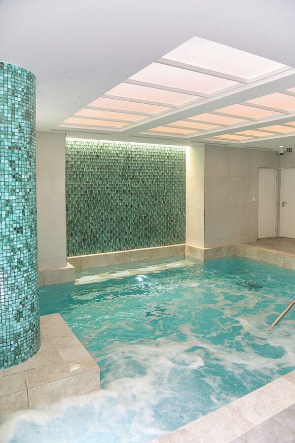 Indoor pool, seasonal outdoor pool, open 10 AM to 8 PM, pool loungers