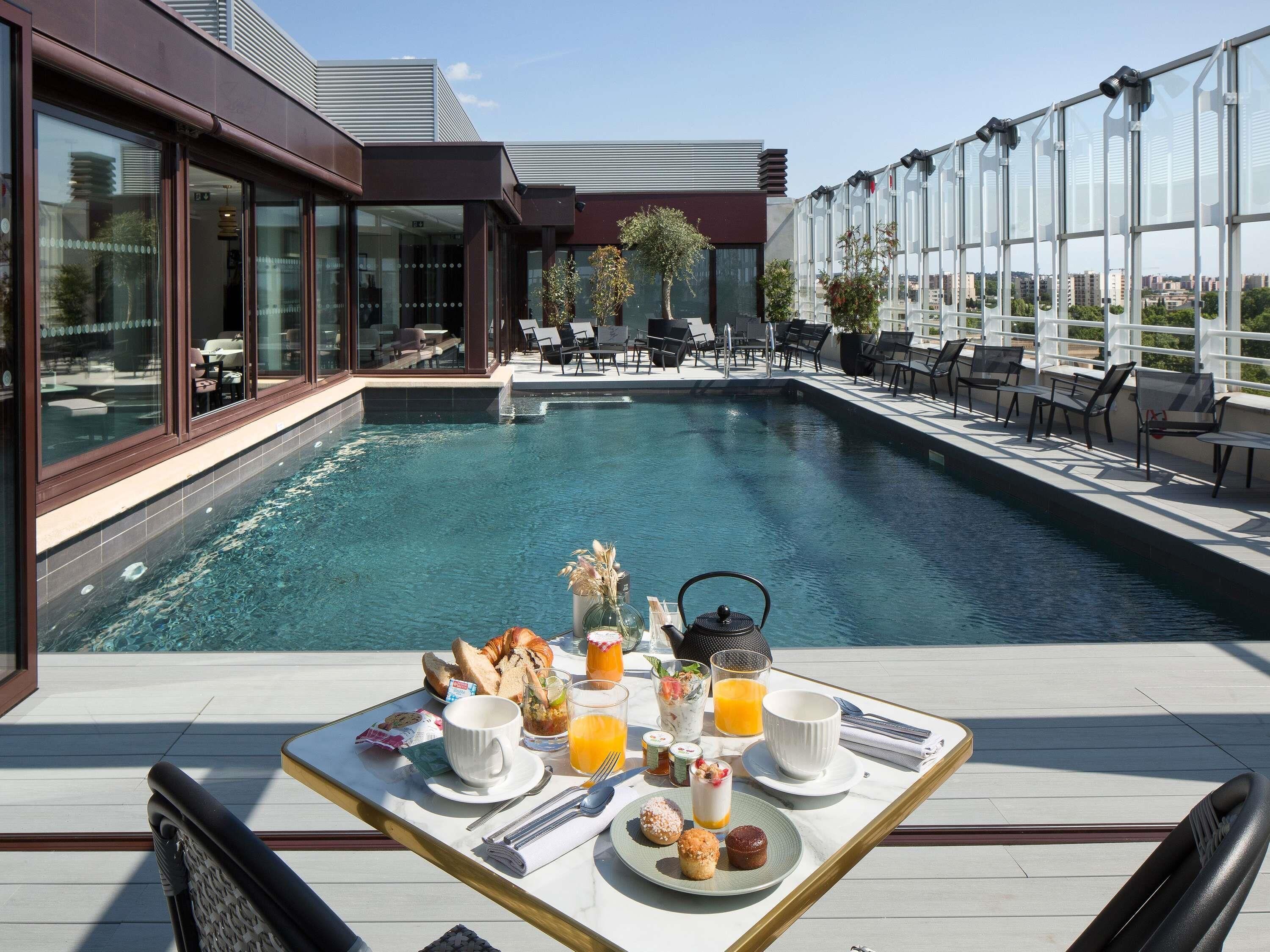Rooftop bar, pool views, open daily