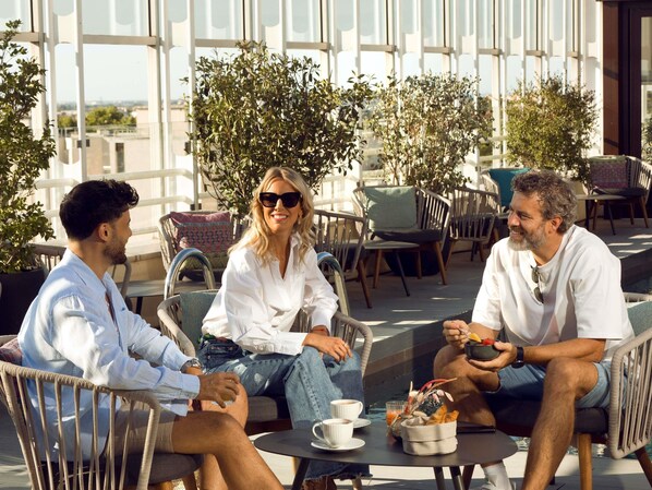 Rooftop bar, pool views, open daily