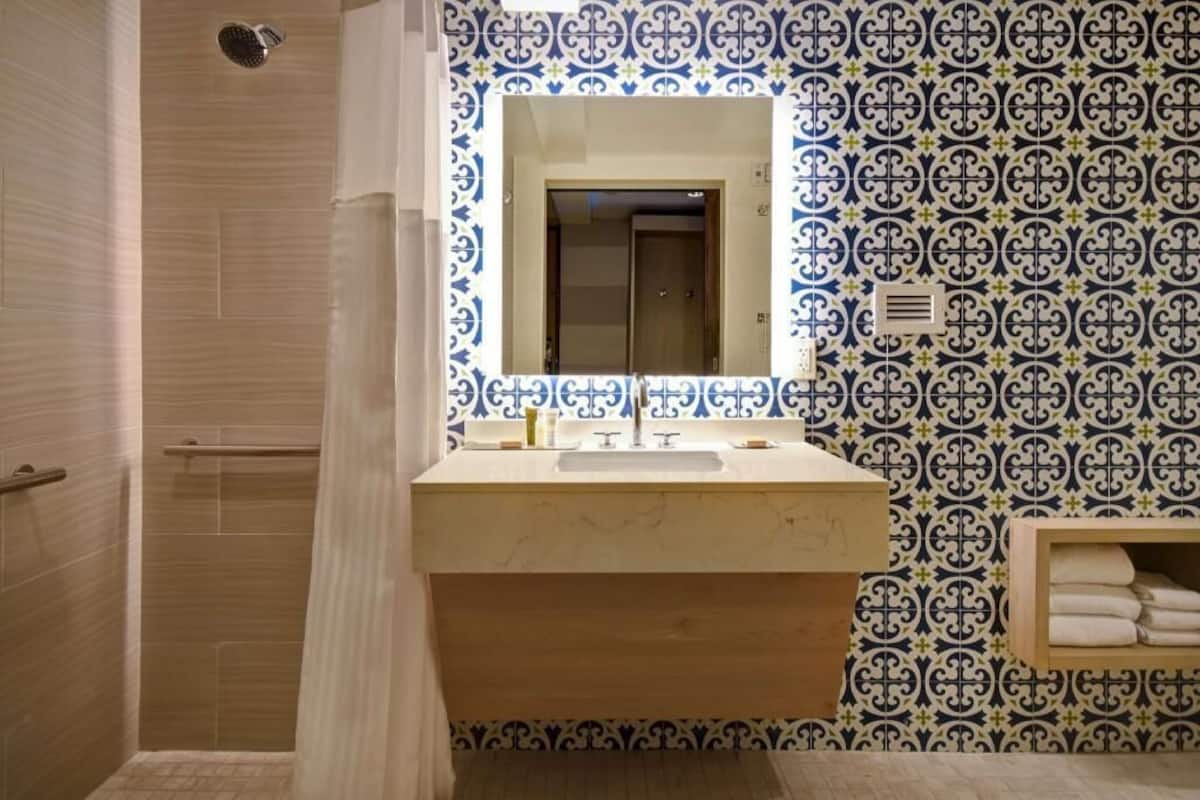 Designer toiletries, hair dryer, towels, soap