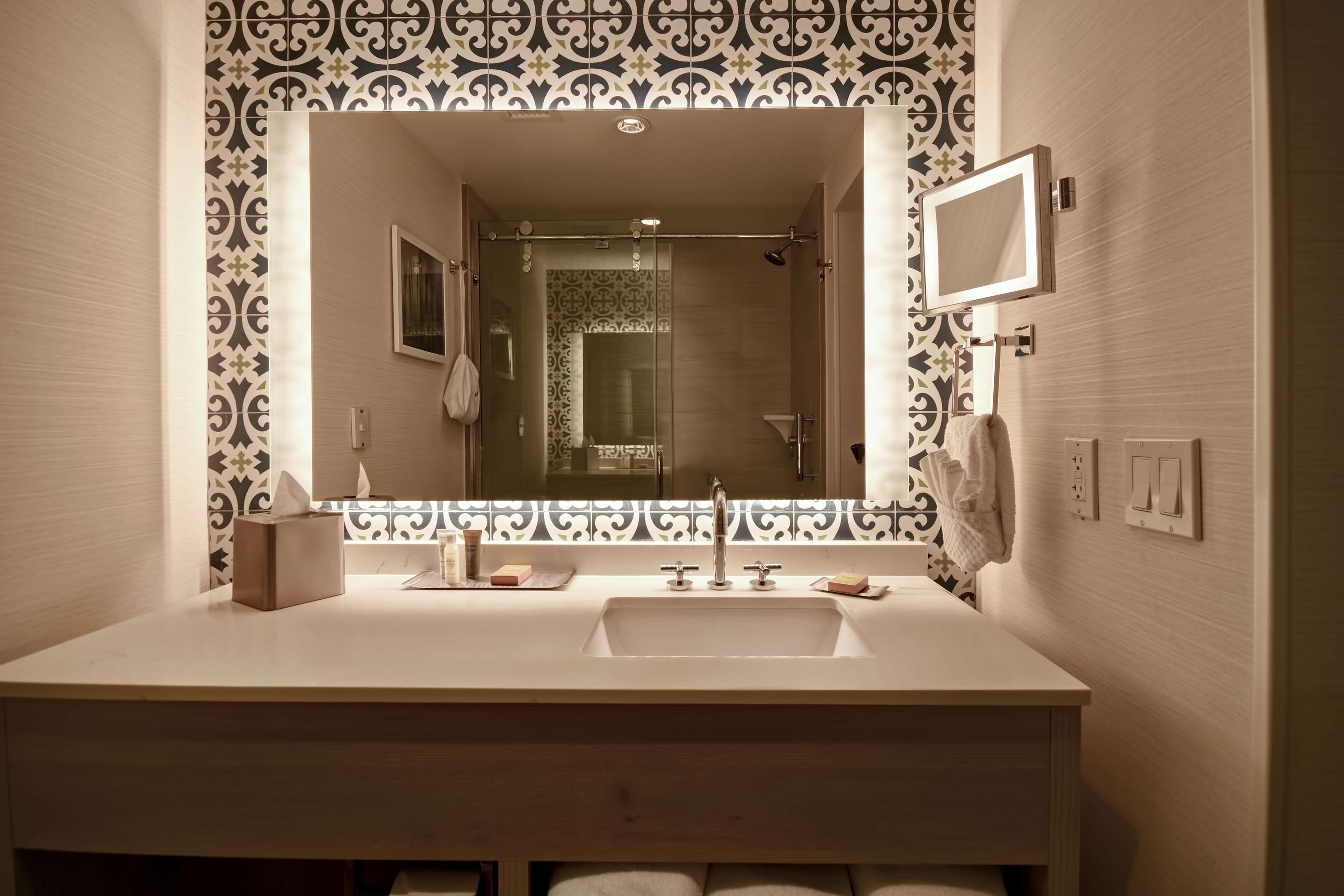 designer toiletries, hair dryer, towels, soap