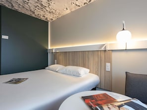 Hypo-allergenic bedding, desk, blackout drapes, soundproofing