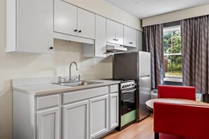 Deluxe Suite, 2 Queen Beds, Non Smoking | Private kitchen | Fridge, microwave, coffee/tea maker, eco-friendly cleaning products