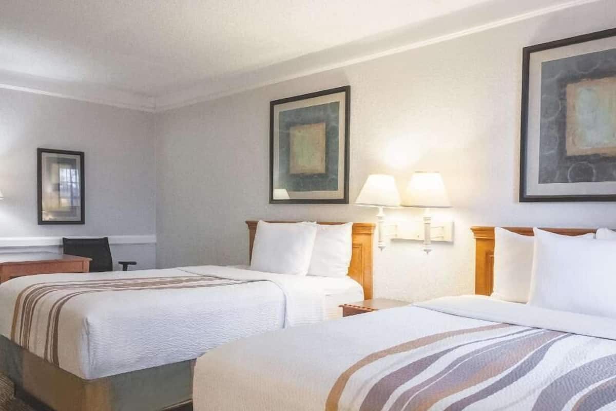 Premium bedding, desk, laptop workspace, iron/ironing board