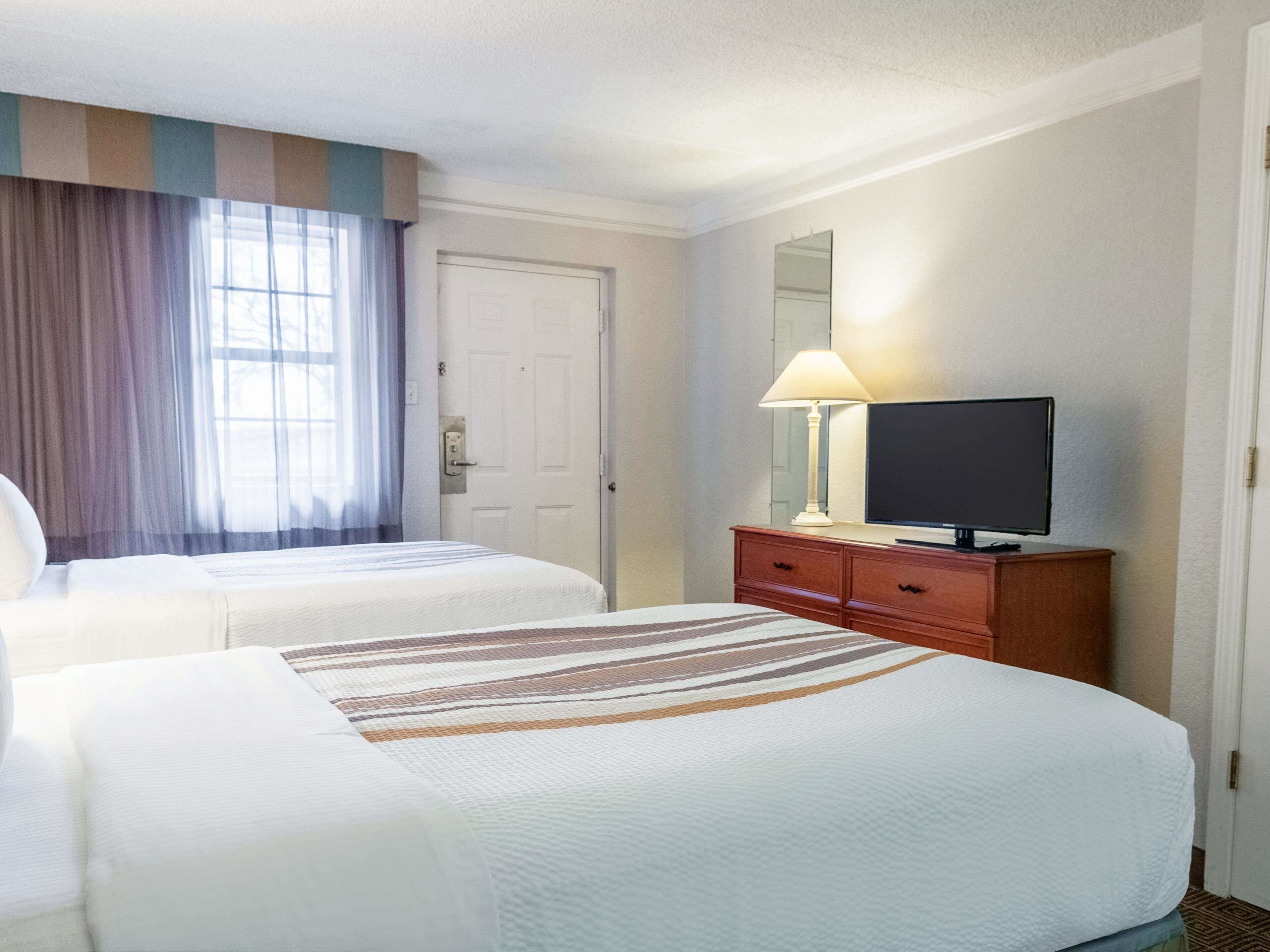 Premium bedding, desk, laptop workspace, iron/ironing board