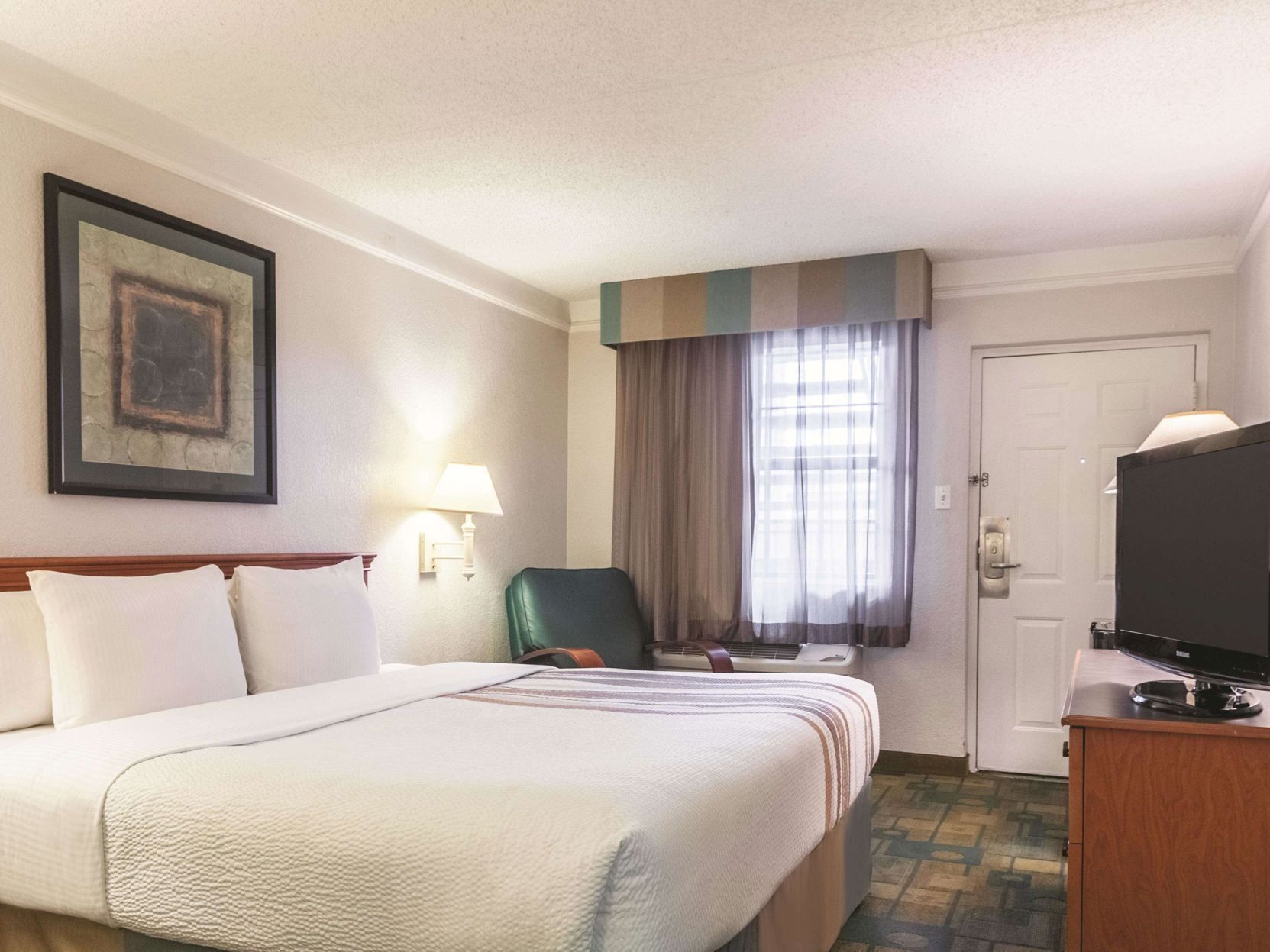 Premium bedding, desk, laptop workspace, iron/ironing board