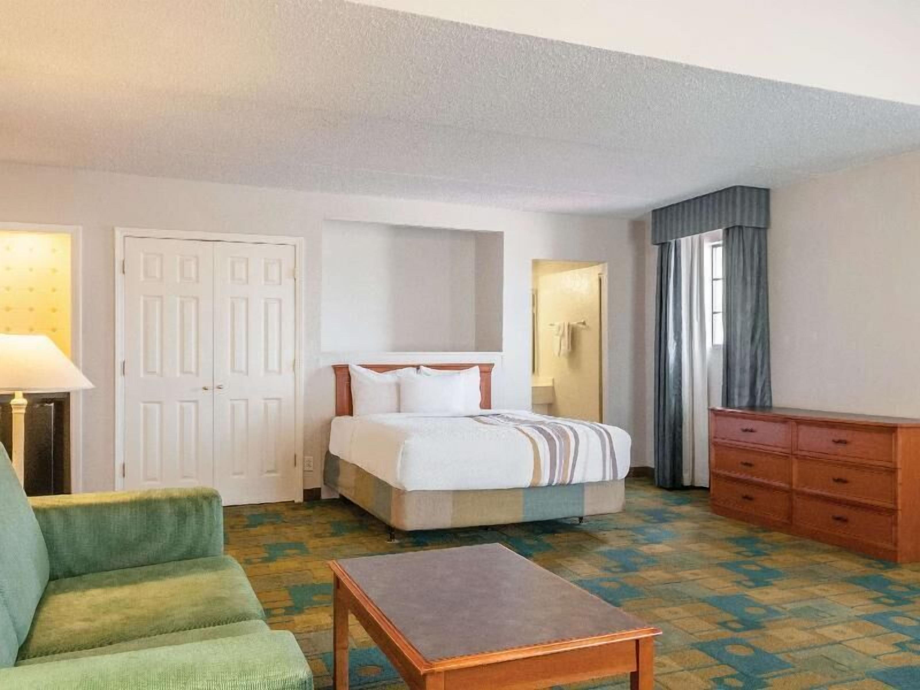Premium bedding, desk, laptop workspace, iron/ironing board