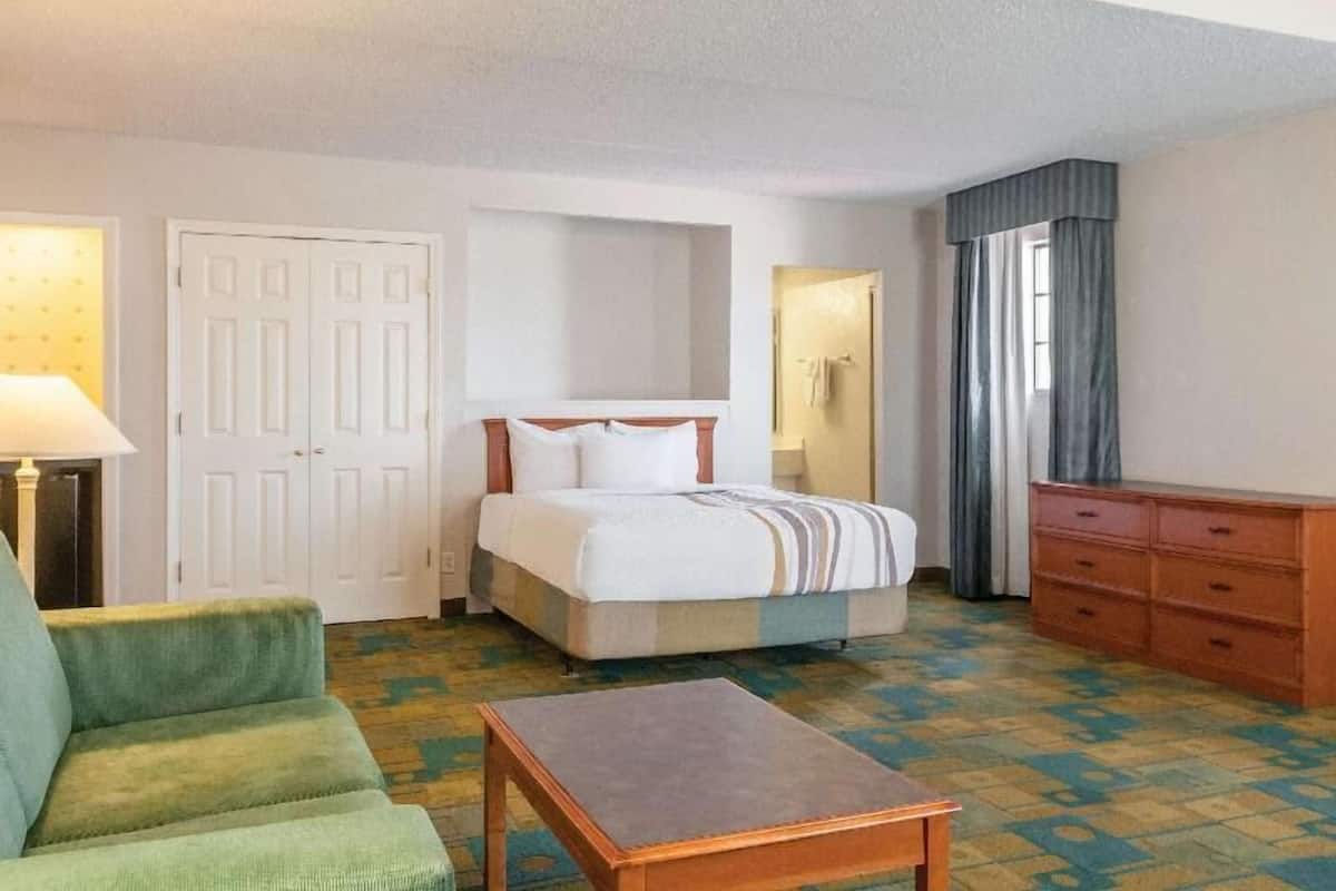 Premium bedding, desk, laptop workspace, iron/ironing board