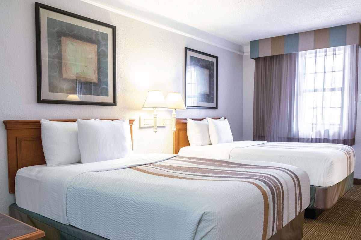 Premium bedding, desk, laptop workspace, iron/ironing board