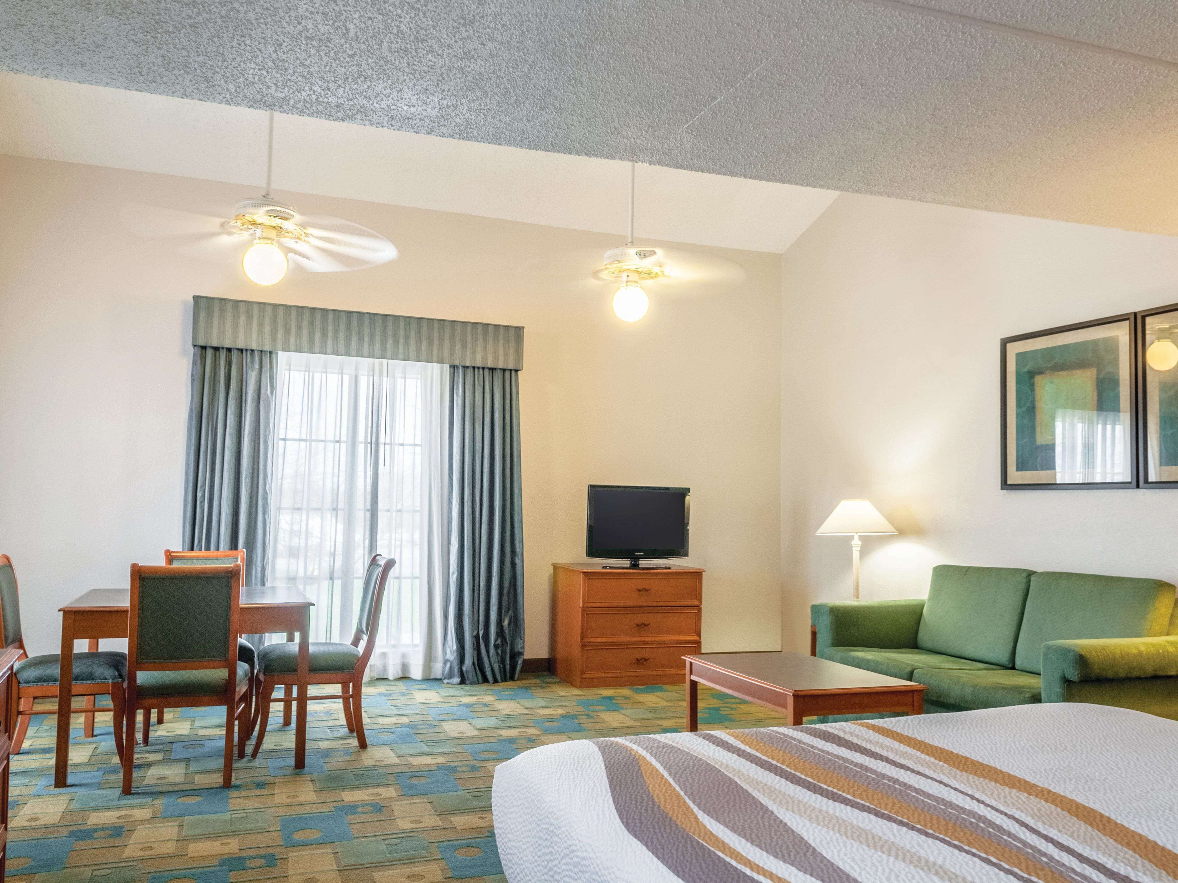Premium bedding, desk, laptop workspace, iron/ironing board