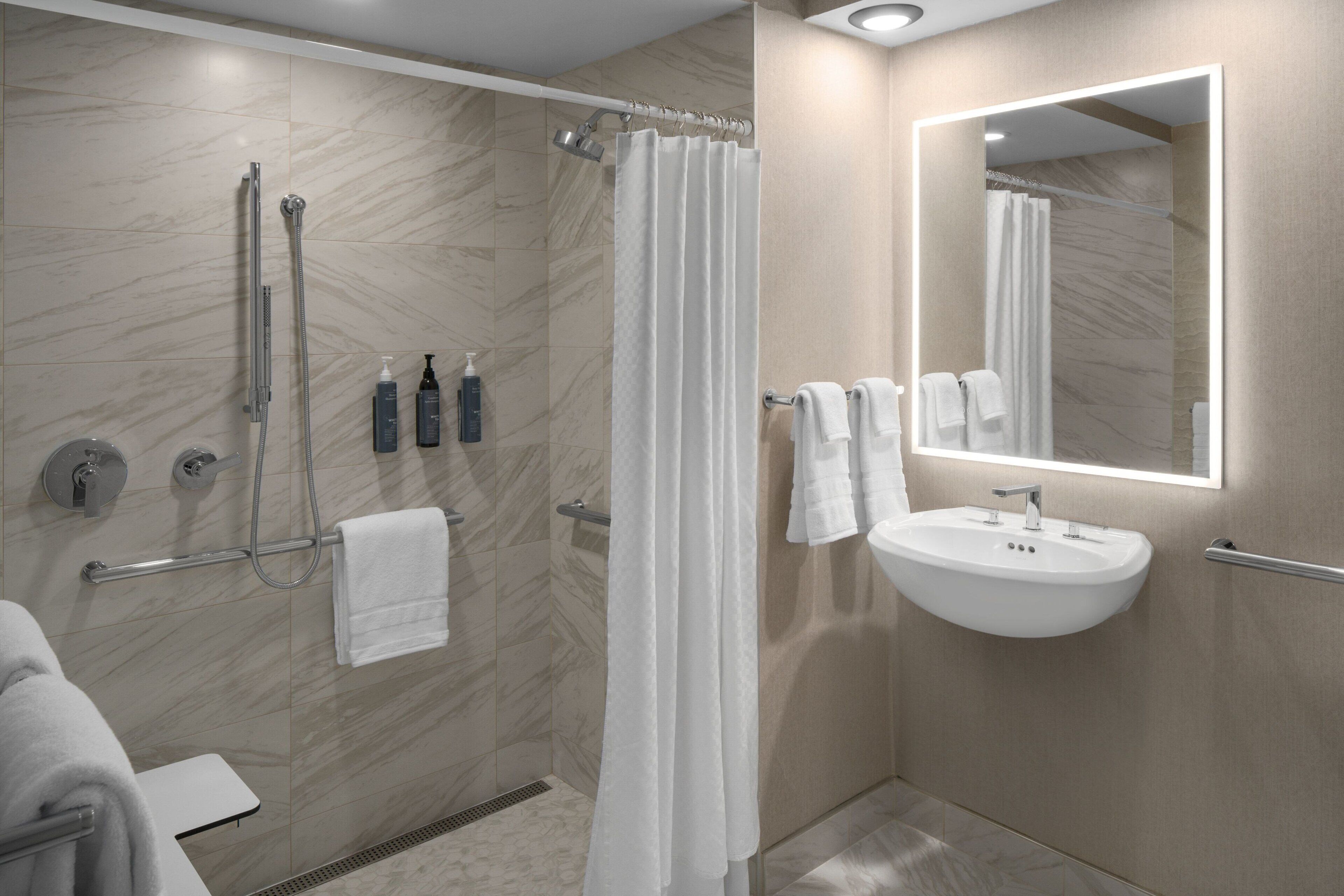 combined shower/bathtub, eco-friendly toiletries, hair dryer, bathrobes
