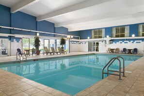 Indoor pool, open 7:00 AM to 11:00 PM, pool loungers