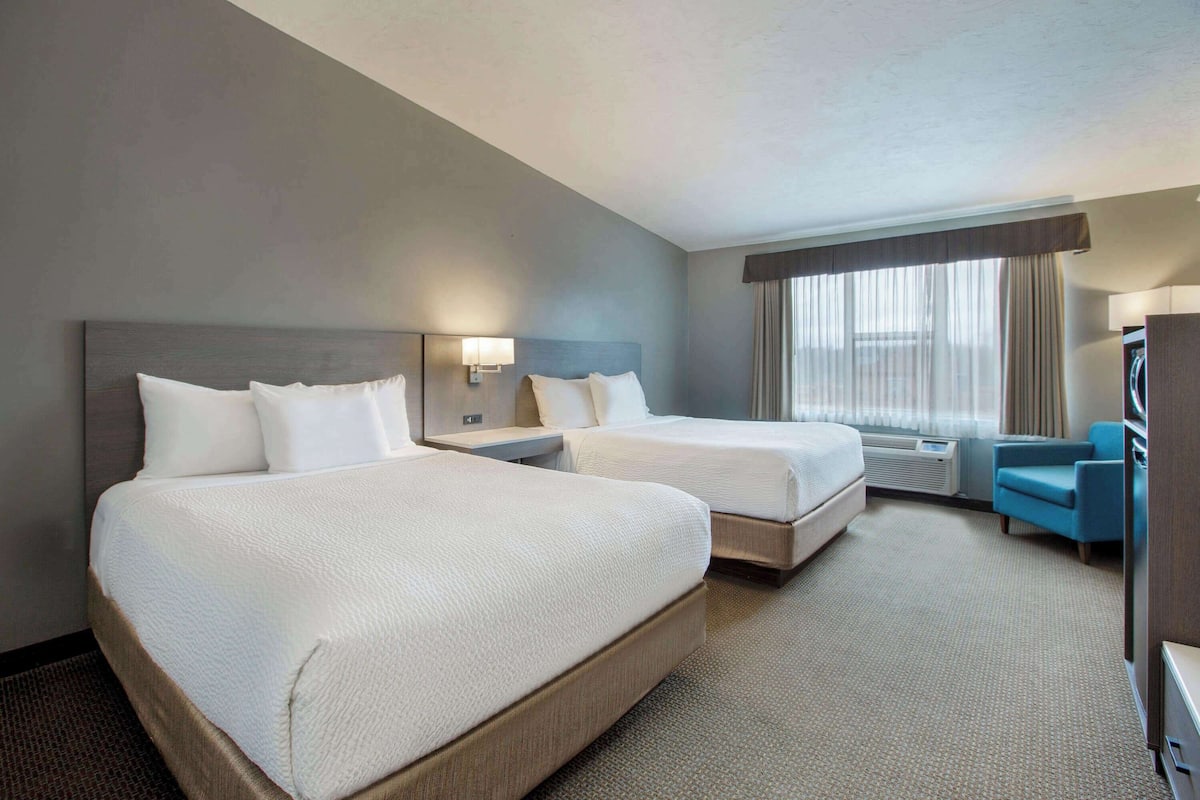 Standard Room, 2 Queen Beds, Non Smoking, Microwave | In-room safe, desk, iron/ironing board, free cots/infant beds