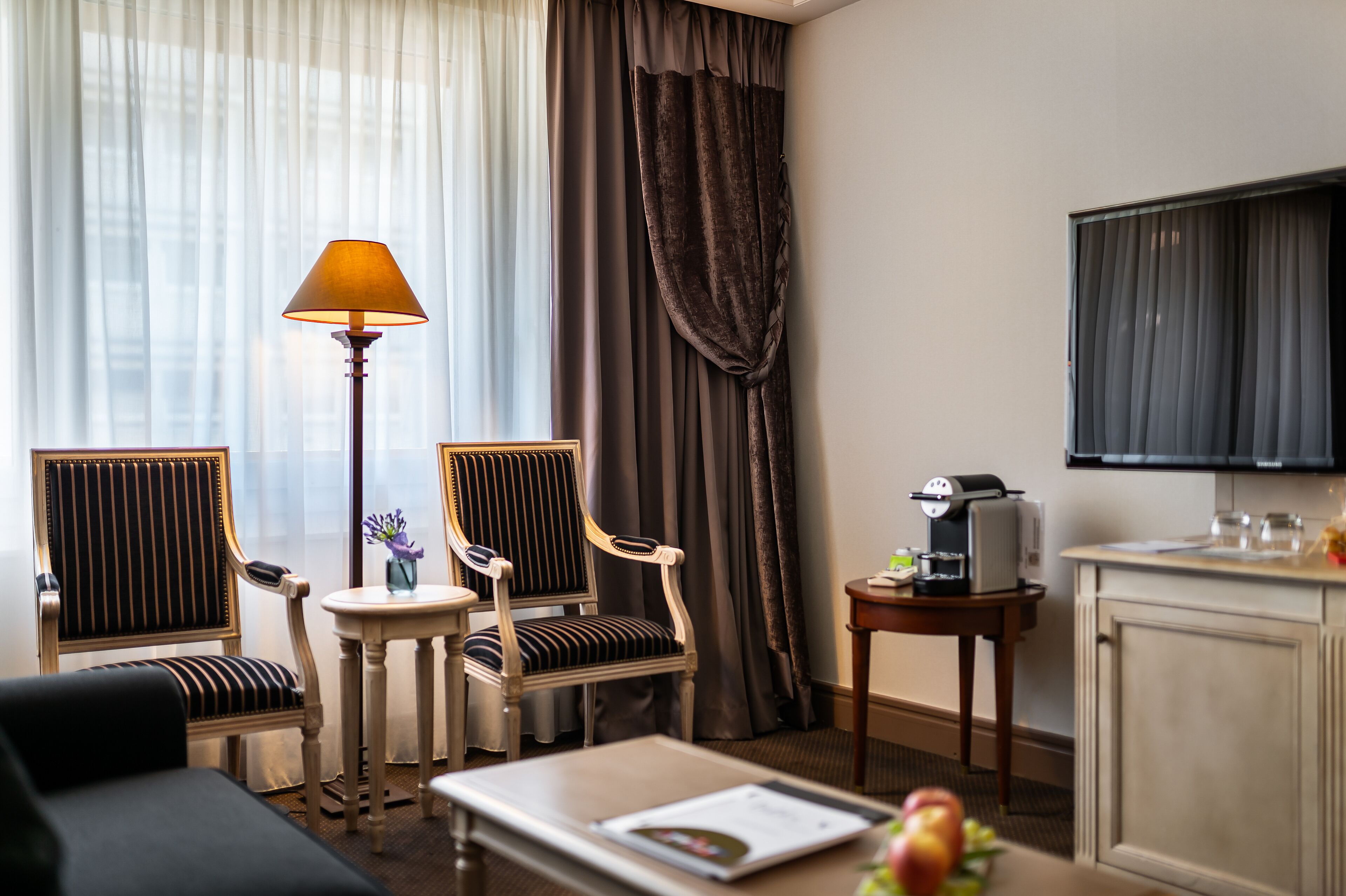 family room | 1 bedroom, minibar, in-room safe, desk