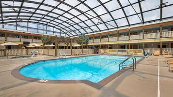 Indoor pool, open 9:00 AM to 10:00 PM, pool umbrellas, pool loungers