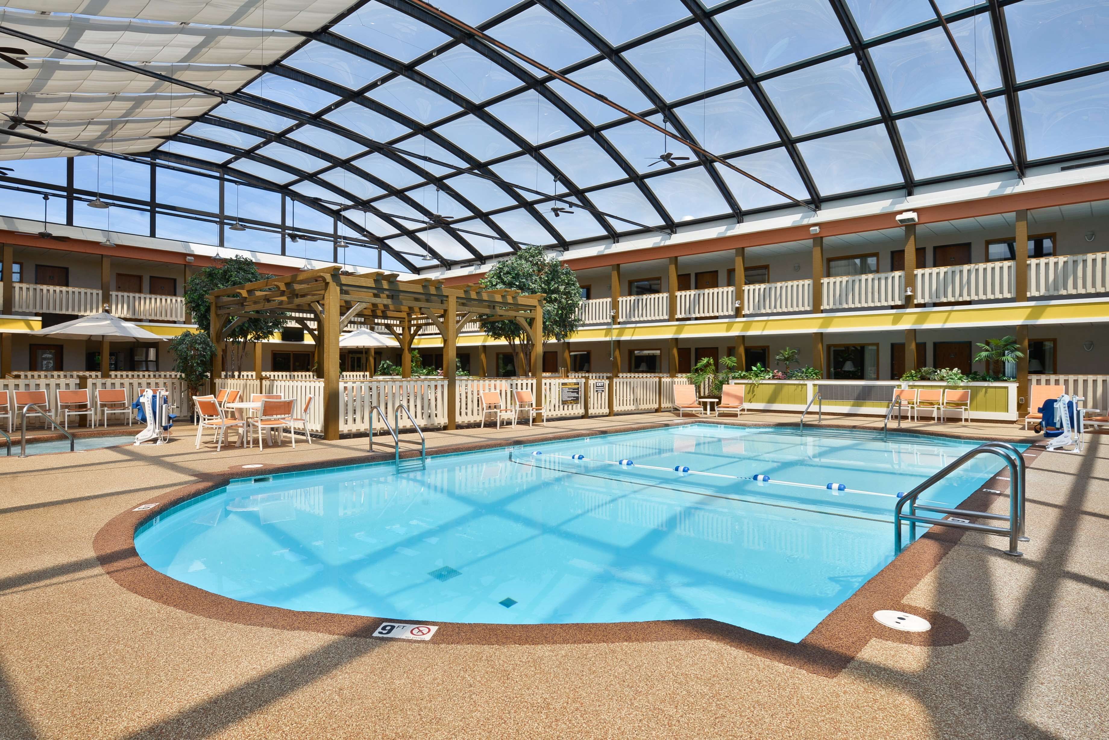 indoor pool, open 8:00 am to 10:00 pm, pool umbrellas, pool loungers