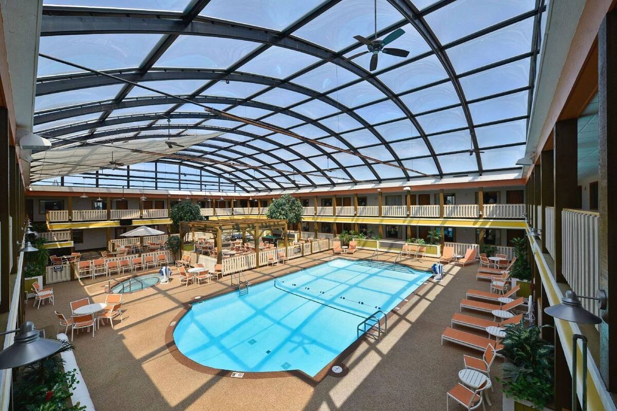 Pool | Indoor pool, open 9:00 AM to 10:00 PM, pool umbrellas, sun loungers